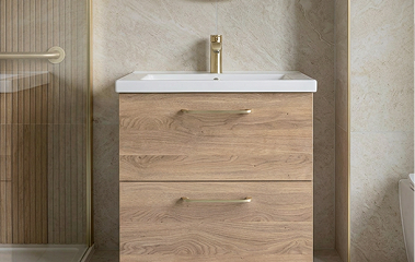 Heritage fixtures with warm stone tiling and a green herringbone feature wall.
